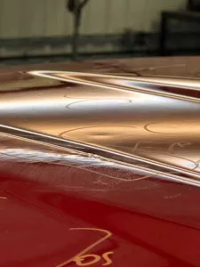 Close up of severe BAD PDR example - dimples in paint on car roof.